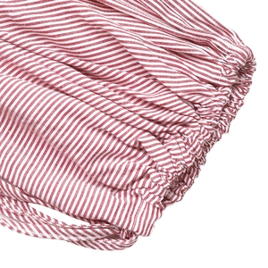 Detail of red and white striped fabric with elastic smocking and fine edge stitching