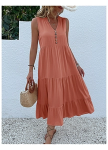 Detail view of coral orange summer maxi dress featuring a V-neck and decorative dark buttons