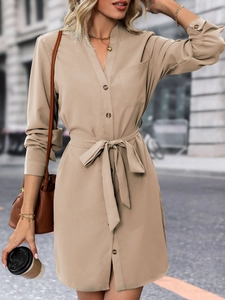 Detail view of khaki long sleeve shirt dress with waist tie and delicate button placket