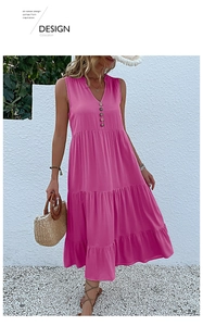 Detail of rose red V-neck maxi dress featuring decorative wooden buttons and tiered skirt