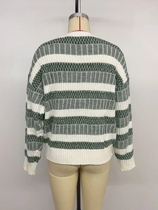 Detailed texture of white and dark green striped knitted sweater from back view