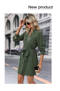 Detail of dark green button-down dress featuring a waist tie and elegant shirt collar