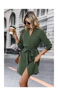 Street style view of army green long sleeve shirt dress with waist tie and V-neckline