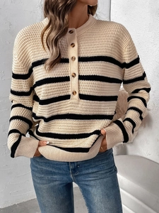 Detail of waffle knit striped Henley sweater with five buttons and ribbed cuffs