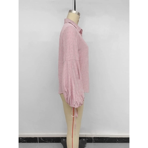 Red and white striped lantern sleeve blouse with cuff tie details, side view on mannequin