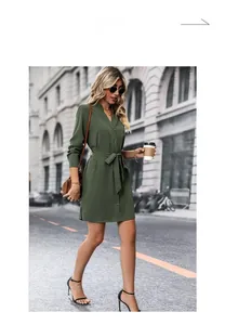 Close-up of elegant dark green long-sleeved shirt dress with lapel collar and waist tie