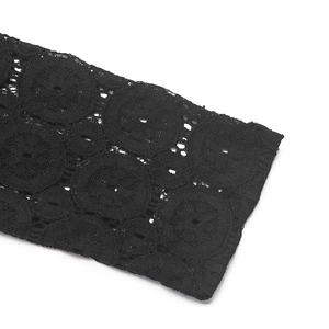 Close-up of black lace bubble sleeve with intricate floral patterns and cutout details
