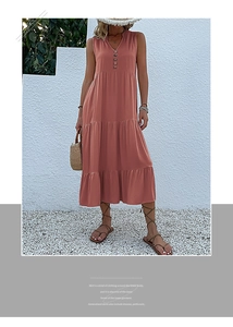 Detail of coral sleeveless maxi dress with V-neckline and decorative vintage buttons
