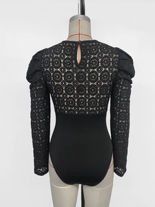 Close-up of black lace bodysuit featuring floral hollow-out back and teardrop button closure