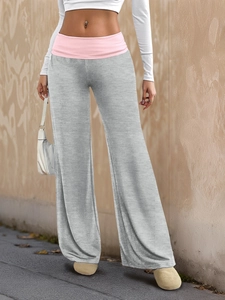 Detail of light gray wide-leg joggers with pink elastic high waistband and soft fabric