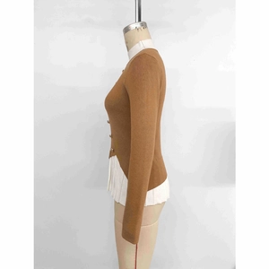 Brown slim-fit knit sweater with decorative gold buttons and white pleated hem contrast