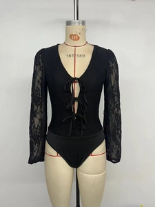 Detail of elegant V-neck bodysuit with lace long sleeves and delicate bow tie-ups