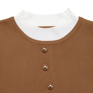 Brown knit sweater with a white mock neck and three golden sphere buttons detailing