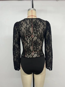 Detail of the back view showing sheer floral lace fabric on a black long sleeve bodysuit