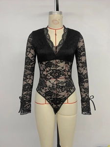 Detail of V-neck bodysuit with floral lace sleeves and delicate ribbon bow cuffs