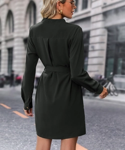 Detail of dark green shirt dress showing back silhouette and waist belt design