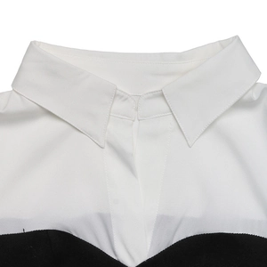 Detail shot of a contrast turn-down collar on a black and white long sleeve shirt dress