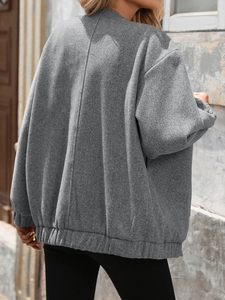 Women's casual grey oversized zip-up jacket with textured fabric and elastic hem