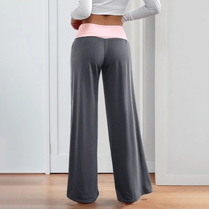 Women's dark gray wide-leg yoga pants with pink high waistband shown from the back view