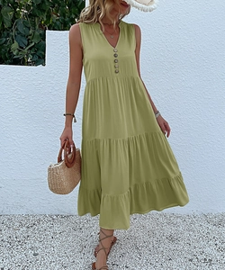 Detail of olive green sleeveless V-neck maxi dress with decorative buttons and tiered skirt