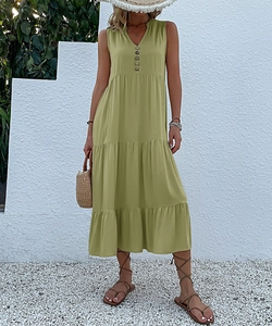 Detail of olive green sleeveless V-neck maxi dress with buttons and tiered skirt