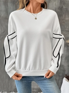 Women's white crewneck sweatshirt with black contrast piping and bow sleeve details