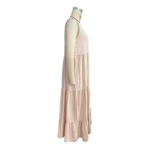 Detail of light pink sleeveless tiered maxi dress with layered skirt for summer