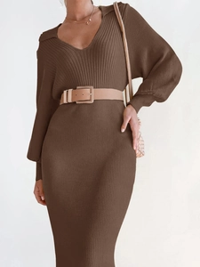 Close-up of deep V-neck knit dress with brown vertical ribbing and metal buckle belt
