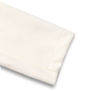 Close-up of premium ivory wool coat showing high-quality fabric texture and stitching