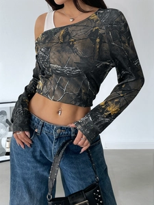 Detailed view of women's off-shoulder camo crop top with a slim-fit asymmetrical design