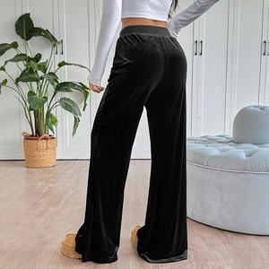 Women's black velvet high-waisted wide-leg trousers with sleek silky finish and drape