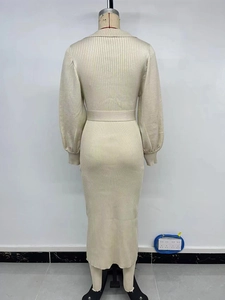 Detail of knit midi dress featuring lantern sleeves and ribbed texture from the back