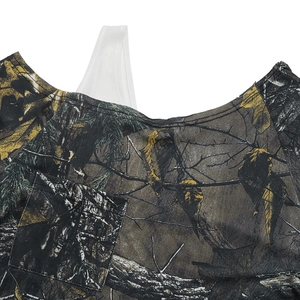 Detail of camouflaged t-shirt with realistic forest print and white strap detail