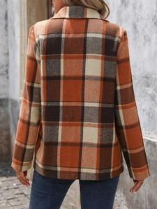 Back view of a vintage-style orange and brown plaid long-sleeve blazer for women