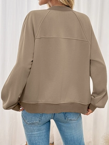 Detail view of khaki casual hoodie showing back seam stitching and ribbed knit cuffs