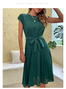 Detail of dark green pleated dress with matching waist tie and elegant round neckline