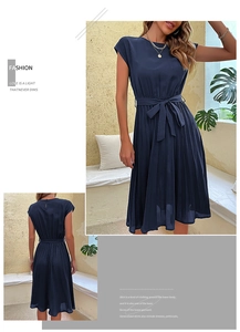 Detail view of navy blue sleeveless pleated midi dress with adjustable waist tie