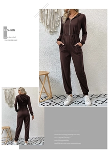 Detail of dark brown hooded jumpsuit with zip front and elasticated waist detail