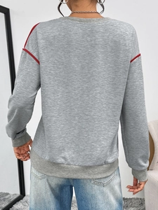Rear view of grey pullover sweatshirt featuring red shoulder stripes and ribbed cuffs