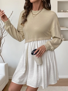 Detail of color-block casual dress with khaki sweatshirt top and white pleated skirt