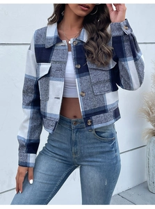 Detail of blue and white plaid cropped jacket with classic collar and chest pockets