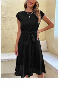 Detail of waist tie bow and pleated texture on black short sleeve midi dress