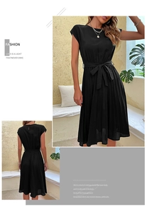 Detail of black sleeveless pleated midi dress featuring a self-tie bow waist and round neck