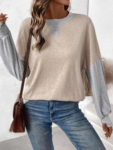 Detail of color-block crewneck sweatshirt with khaki body and gray long sleeves