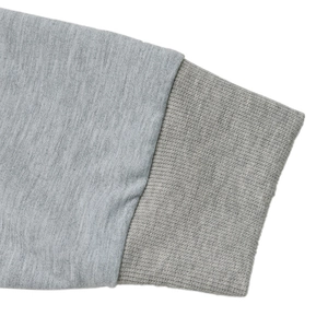 Detailed close-up of grey sweatshirt ribbed cuffs showing high-quality knitted fabric texture
