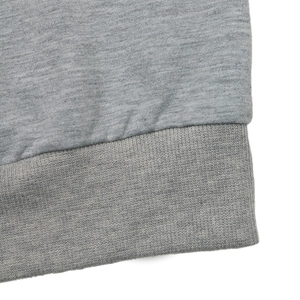 Close-up of gray heather sweatshirt ribbed hem and detailed flat knit fabric texture