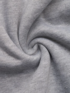 Close-up of thick heather grey knit fabric showing soft fleece texture and durability