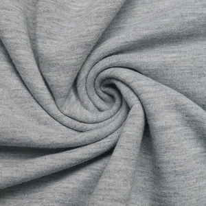 Macro shot showing soft heather grey knit fabric texture with flexible drape and fine grain