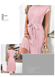 Detail of pink pleated midi dress with short sleeves and a matching waist tie