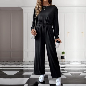 Chic black long sleeve jumpsuit with wide leg and cinched waist for casual autumn style